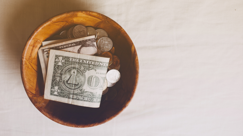 money and coins in a bowl