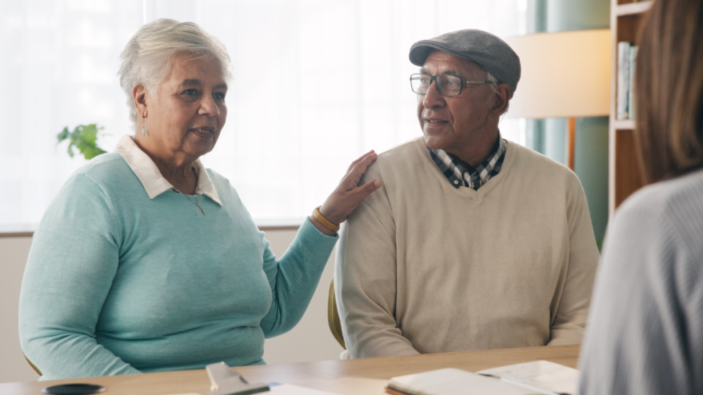 a couple sitting at their attorney's office