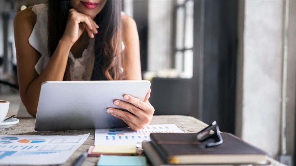 women reading about investment options