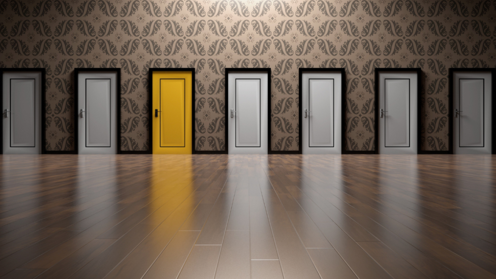 yellow door in a row of white doors