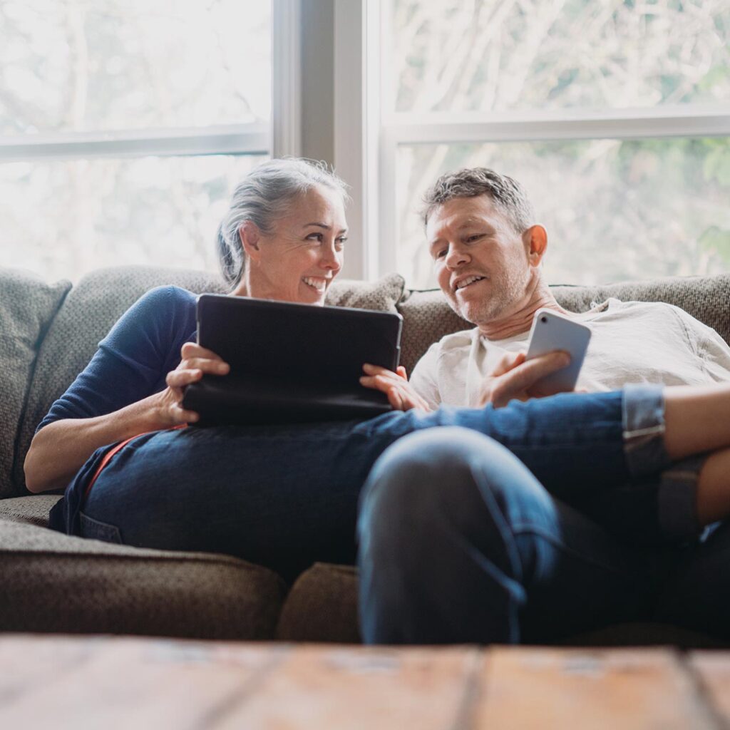 Financial Planning for Empty Nesters Sitting on Couch